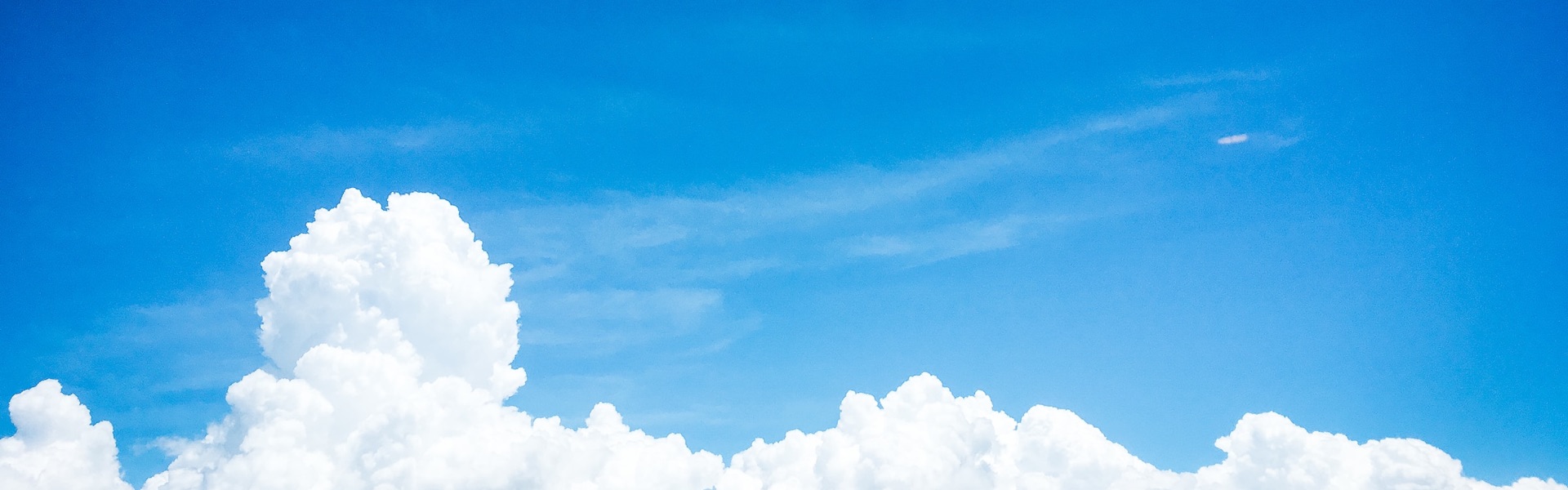 A view of white clouds and a blue sky